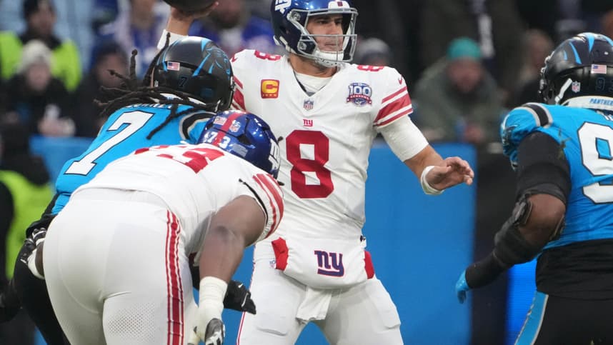 Nov 10, 2024; Munich, Germany; New York Giants quarterback Daniel Jones (8) throws the ball against the Carolina Panthers in the first half during the 2024 NFL Munich Game at Allianz Arena. Mandatory Credit: Kirby Lee-Imagn Images