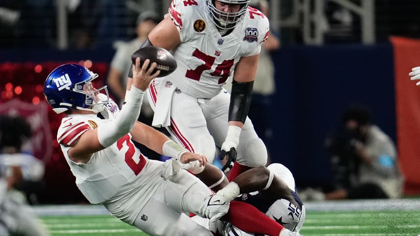 Nov 28, 2024; Arlington, Texas, USA;  New York Giants quarterback Drew Lock (2) is sacked by Dallas Cowboys defensive end Carl Lawson (55) during the second half at AT&T Stadium. Mandatory Credit: Chris Jones-Imagn Images