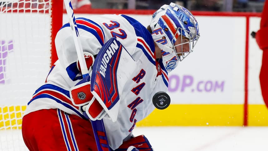 Nov 9, 2024; Detroit, Michigan, USA;  New York Rangers goaltender Jonathan Quick (32) makes a save against the Detroit Red Wings in the second period at Little Caesars Arena. Mandatory Credit: Rick Osentoski-Imagn Images