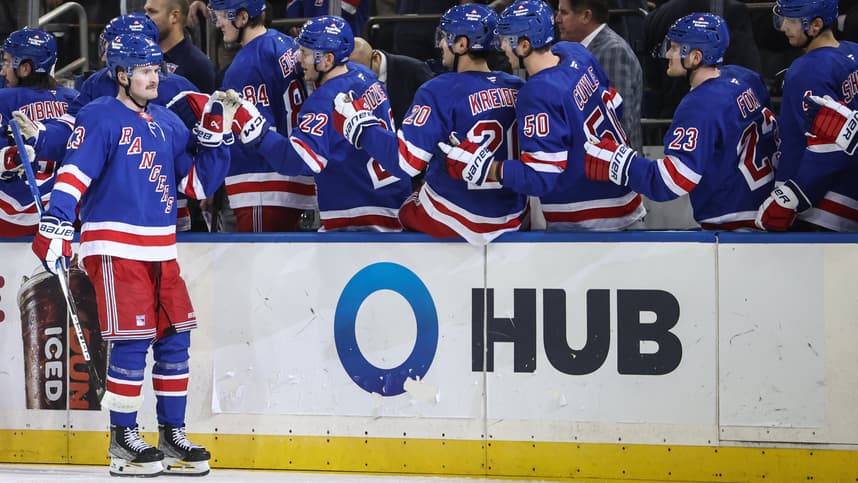 Nov 1, 2024; New York, New York, USA;  New York Rangers left wing Alexis Lafrenière (13) celebrates with his teammates after scoring a goal in the third period against the Ottawa Senators at Madison Square Garden. Mandatory Credit: Wendell Cruz-Imagn Images