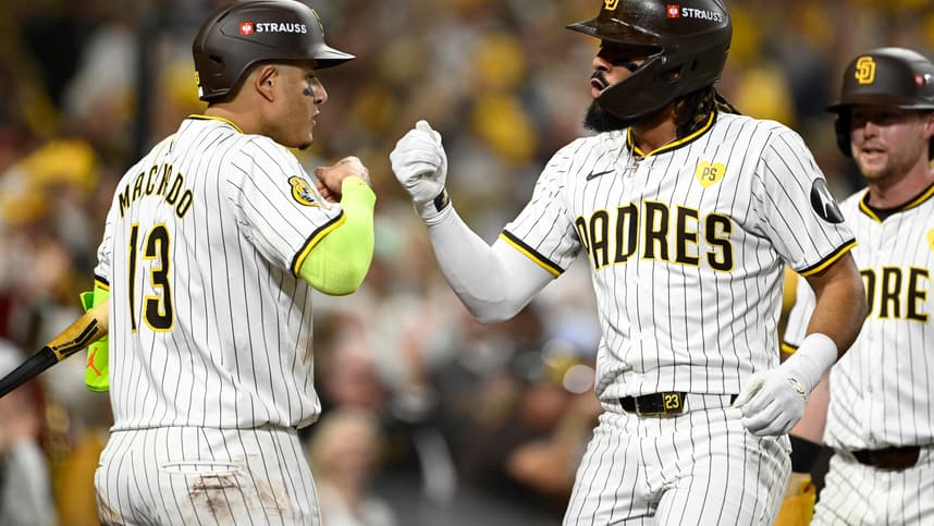 Oct 8, 2024; San Diego, California, USA; San Diego Padres outfielder Fernando Tatis Jr. (23) celebrates with third baseman Manny Machado (13) after hitting a home run in the second inning against the Los Angeles Dodgers during game three of the NLDS for the 2024 MLB Playoffs at Petco Park.  Mandatory Credit: Denis Poroy-Imagn Images