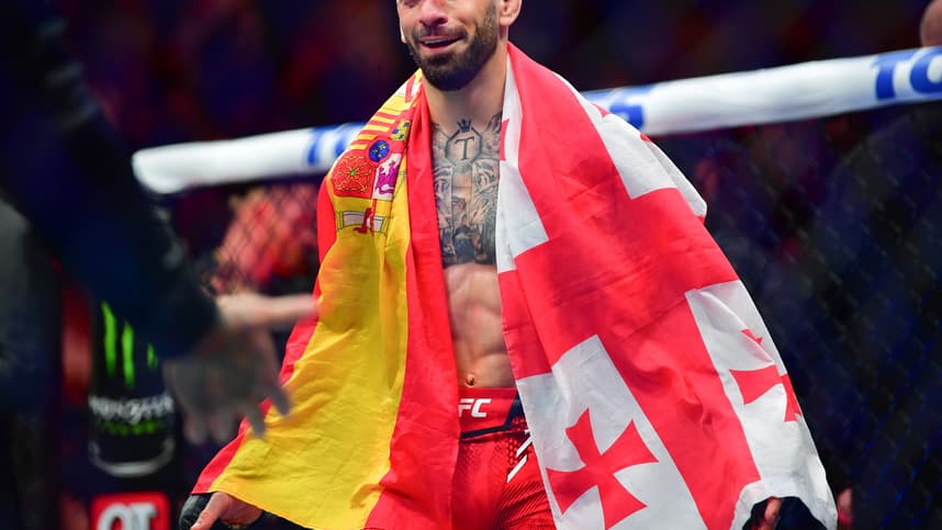 Feb 17, 2024; Anaheim, California, USA; Ilia Topuria celebrates his championship victory against Alexander Volkanovski during UFC 298 at Honda Center. Mandatory Credit: Gary A. Vasquez-Imagn Images