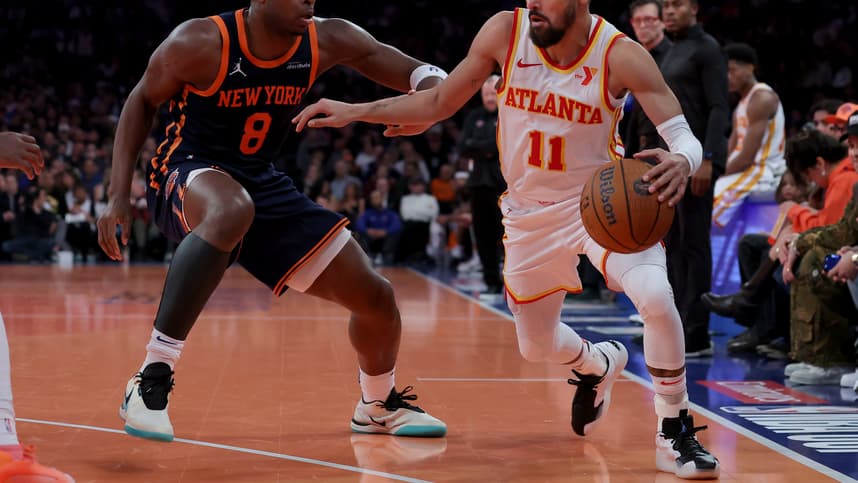Dec 11, 2024; New York, New York, USA; Atlanta Hawks guard Trae Young (11) controls the ball against New York Knicks forward OG Anunoby (8) during the second quarter at Madison Square Garden. Mandatory Credit: Brad Penner-Imagn Images