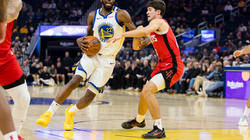 Dec 5, 2024; San Francisco, California, USA;  Houston Rockets guard Reed Sheppard (15) defends against Golden State Warriors forward Andrew Wiggins (22) during the first quarter at Chase Center. Mandatory Credit: John Hefti-Imagn Images