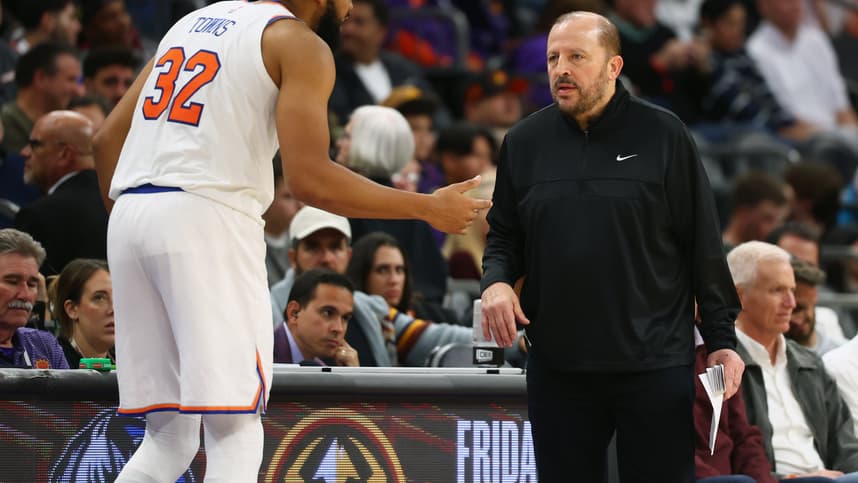 Nov 20, 2024; Phoenix, Arizona, USA; New York Knicks head coach Tom Thibodeau with center Karl-Anthony Towns (32) against the Phoenix Suns at Footprint Center. Mandatory Credit: Mark J. Rebilas-Imagn Images