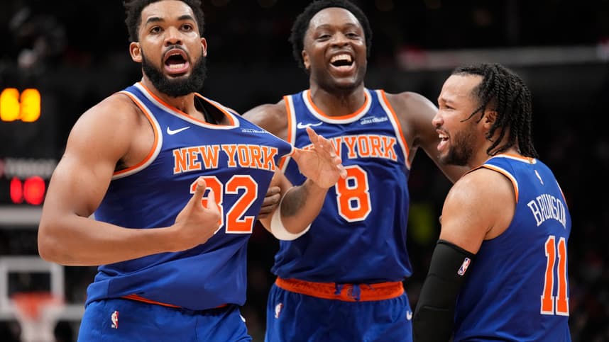 Dec 9, 2024; Toronto, Ontario, CAN; New York  Knicks guard Jalen Brunson (11) and forward OG Anunoby (8) react after a three point basket by center Karl-Anthony Towns (32) to clinch a win over the Toronto Raptors during the second half at Scotiabank Arena. Mandatory Credit: John E. Sokolowski-Imagn Images