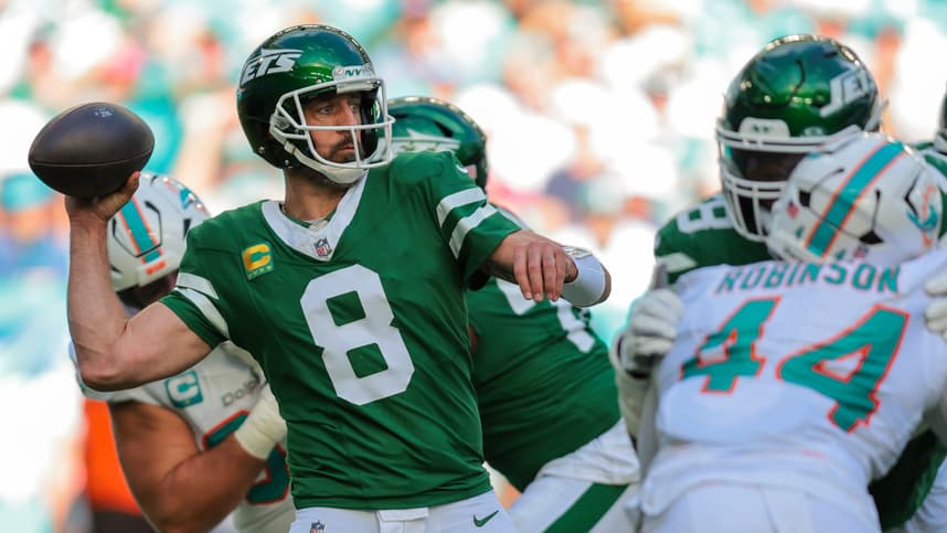 Dec 8, 2024; Miami Gardens, Florida, USA; New York Jets quarterback Aaron Rodgers (8) throws the football against the Miami Dolphins during the second quarter at Hard Rock Stadium. Mandatory Credit: Sam Navarro-Imagn Images