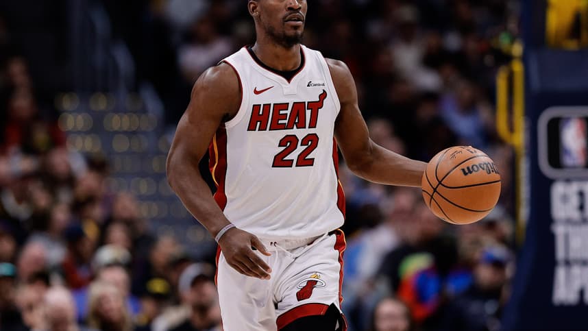 Feb 29, 2024; Denver, Colorado, USA; Miami Heat forward Jimmy Butler (22) dribbles the ball up court in the fourth quarter against the Denver Nuggets at Ball Arena. Mandatory Credit: Isaiah J. Downing-Imagn Images