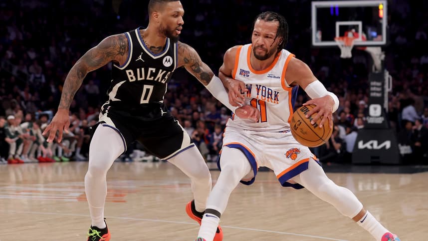 Jan 12, 2025; New York, New York, USA; New York Knicks guard Jalen Brunson (11) controls the ball against Milwaukee Bucks guard Damian Lillard (0) during the first quarter at Madison Square Garden. Mandatory Credit: Brad Penner-Imagn Images