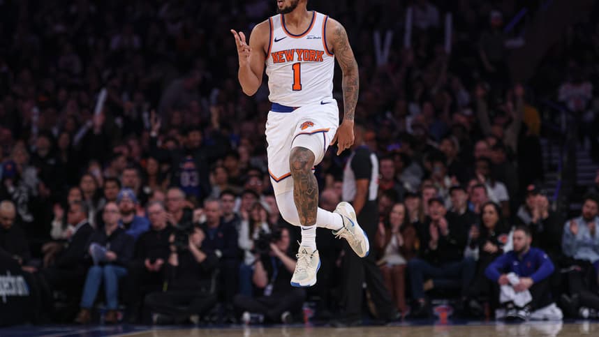 Jan 1, 2025; New York, New York, USA; New York Knicks guard Cameron Payne (1) reacts after a three point basket during the first half against the Utah Jazz at Madison Square Garden. Mandatory Credit: Vincent Carchietta-Imagn Images