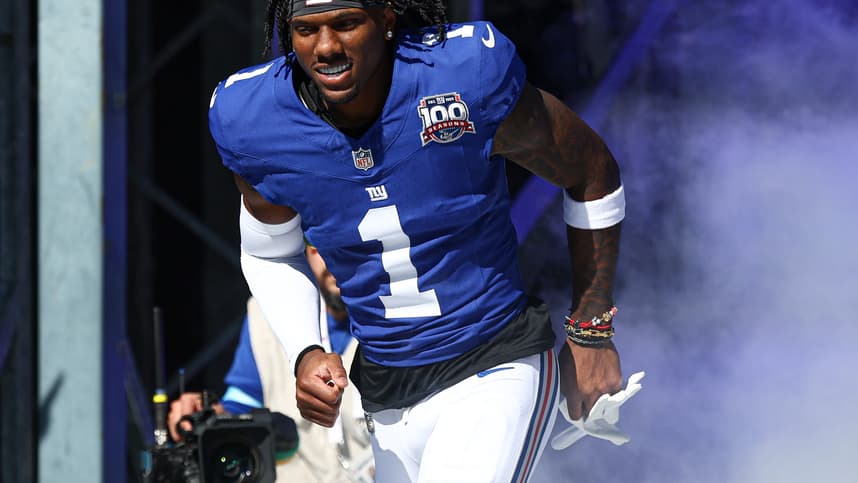 Oct 20, 2024; East Rutherford, New Jersey, USA; New York Giants wide receiver Malik Nabers (1) enter the field during introductions before the game against the Philadelphia Eagles at MetLife Stadium. Mandatory Credit: Vincent Carchietta-Imagn Images