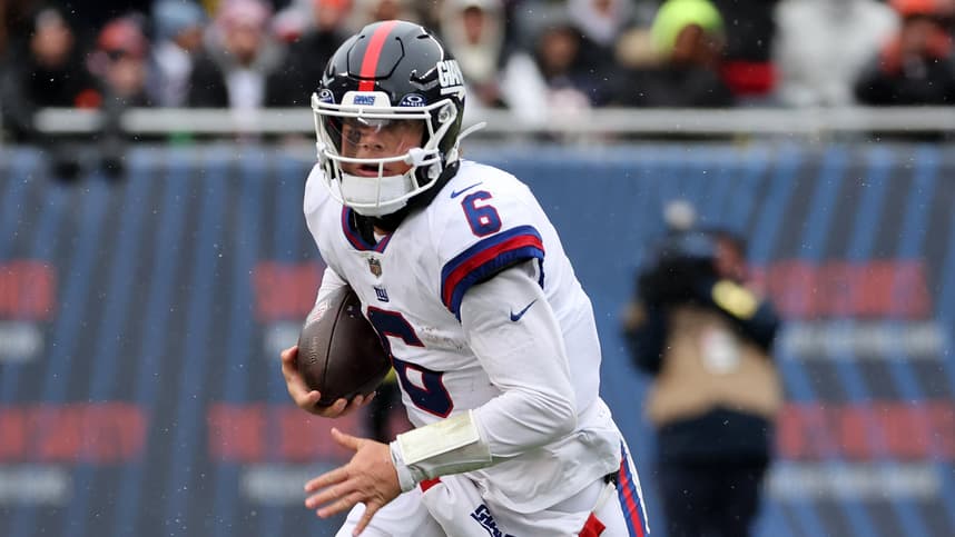 Nov 9, 2025; Chicago, Illinois, USA; New York Giants quarterback Jaxson Dart (6) rushes the ball against the Chicago Bears during the second half at Soldier Field. Mandatory Credit: Mike Dinovo-Imagn Images