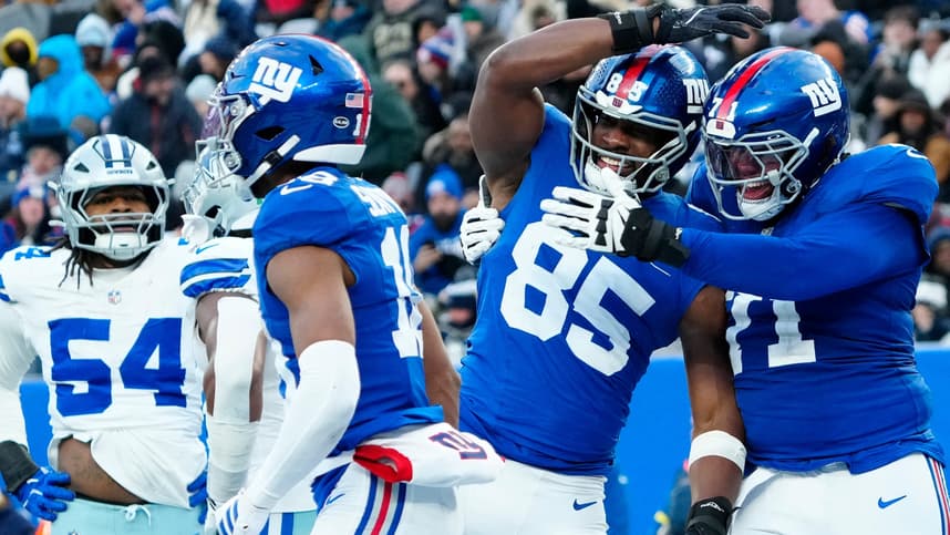 Marcus Mbow celebrates with Giants teammates during a game