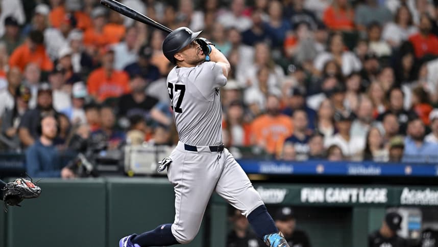 Giancarlo Stanton swings for the Yankees against Houston