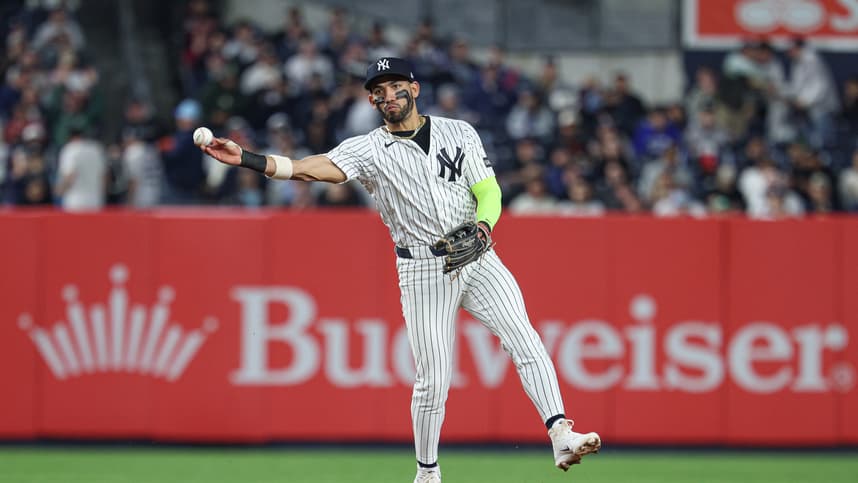 Jose Caballero throws across the diamond for the Yankees at Yankee Stadium