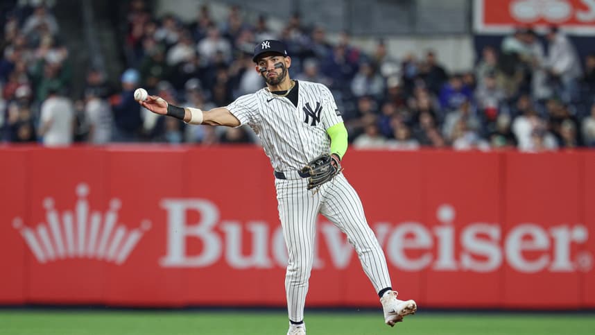 Jose Caballero throws across the diamond for the Yankees at Yankee Stadium