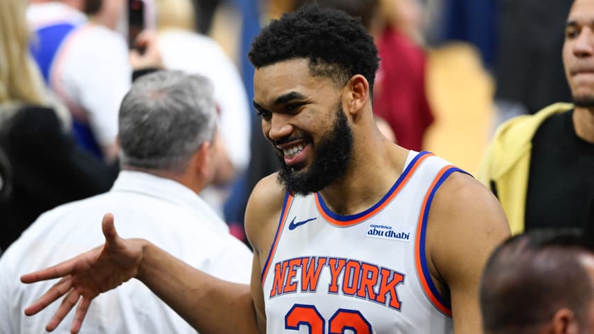 Karl-Anthony Towns celebrates with Knicks teammates after beating the Cavaliers