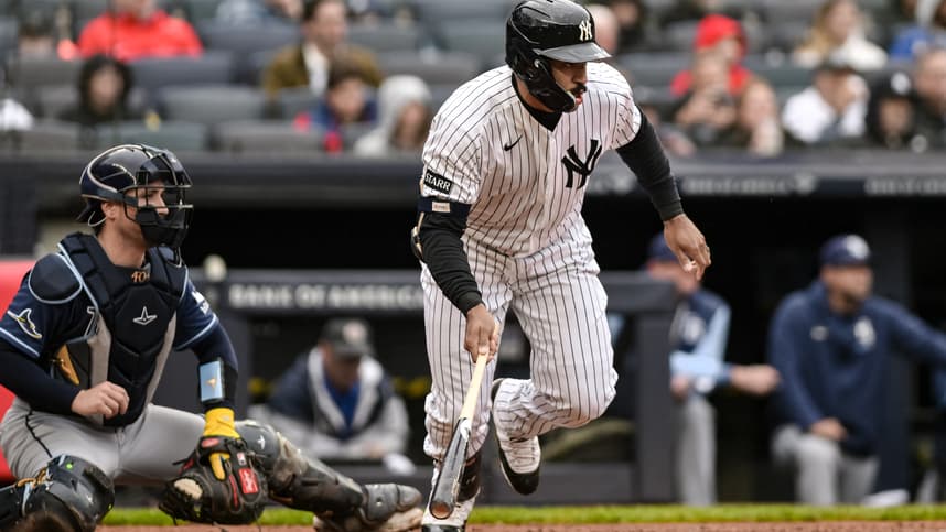 Trent Grisham hits a single for the Yankees against the Rays