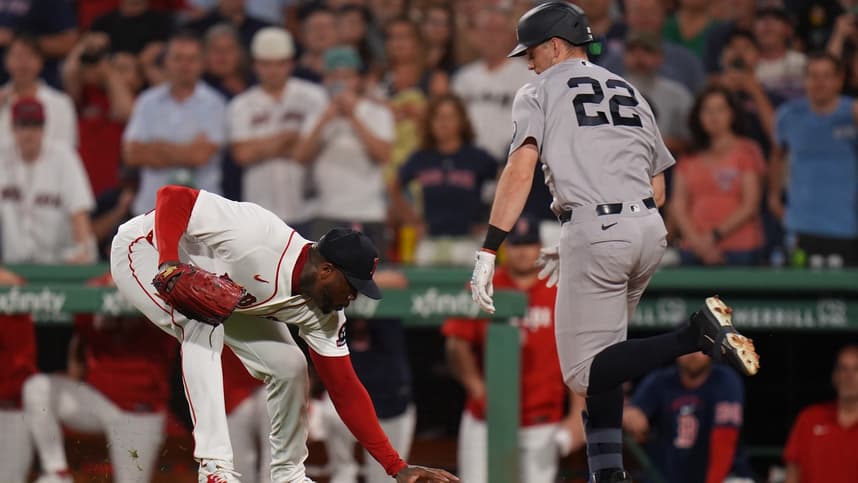 Ben Rice reaching first base for the Yankees at Fenway Park