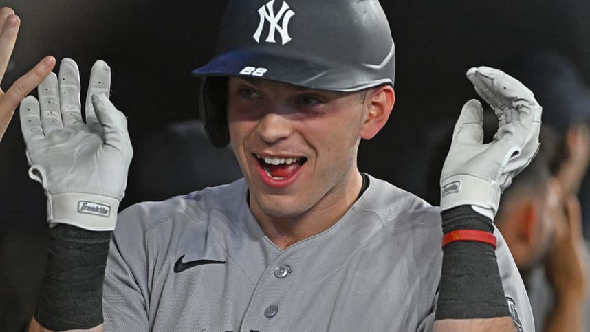 Ben Rice celebrating a home run in the Yankees dugout