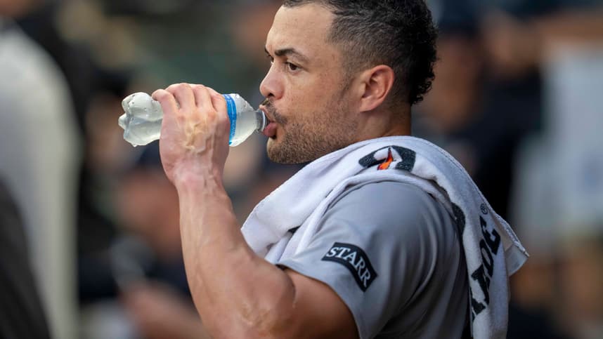 Giancarlo Stanton watching from the Yankees dugout