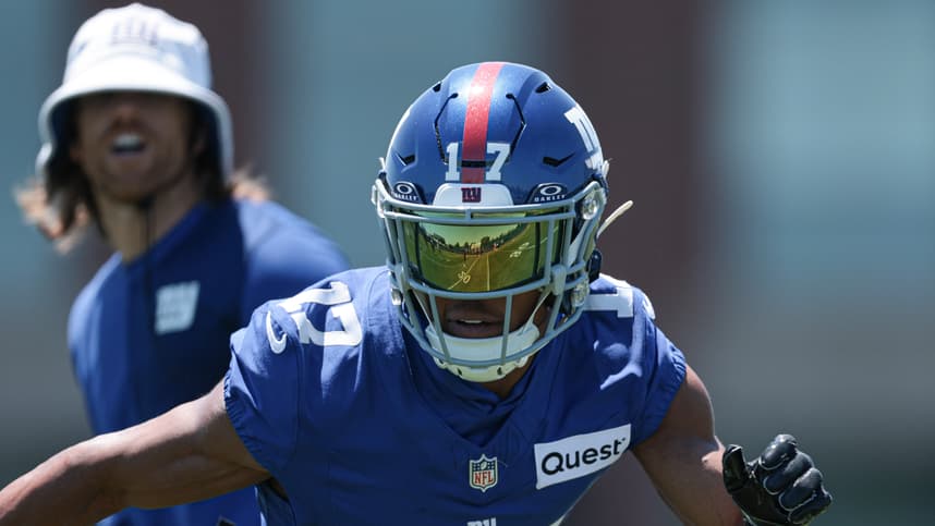 Darnell Mooney runs after a catch during Giants organized team activities