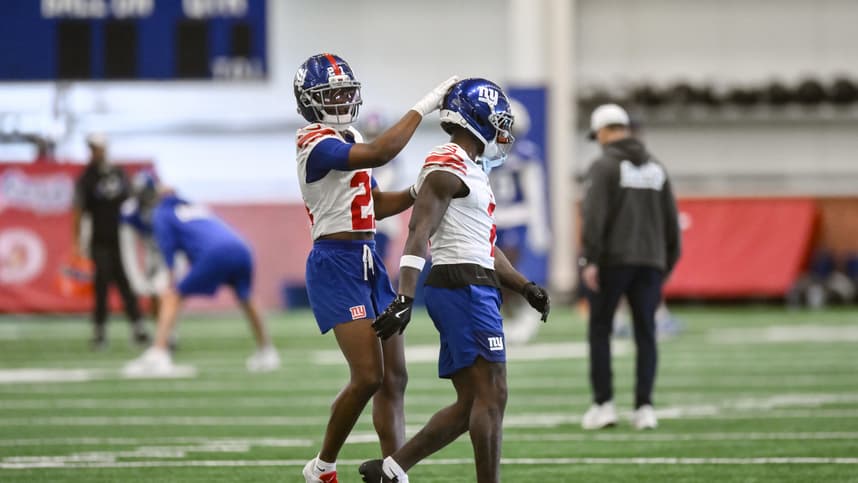 Deonte Banks works with Paulson Adebo during Giants organized team activities