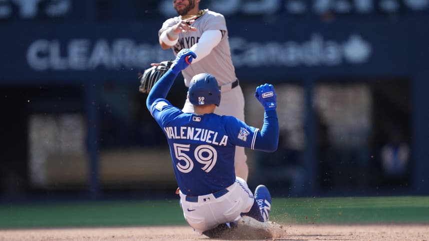 José Caballero makes a tag for the Yankees against Toronto
