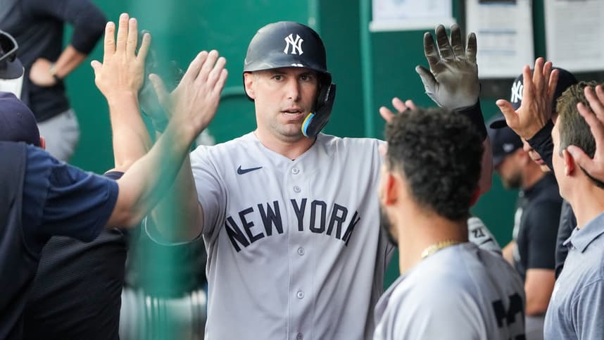 Paul Goldschmidt celebrates in the Yankees dugout against the Royals