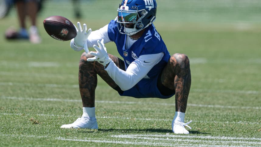 Odell Beckham Jr. reaches for a catch during an NFL game