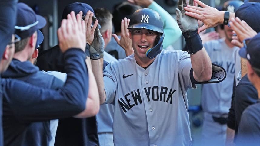 Paul Goldschmidt celebrates in the Yankees dugout after a home run