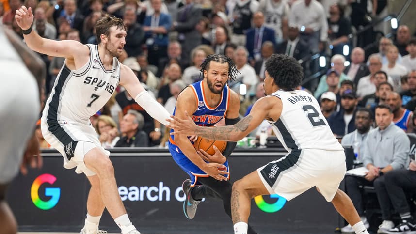 Jalen Brunson drives past Spurs defenders during Game 2 of the NBA Finals