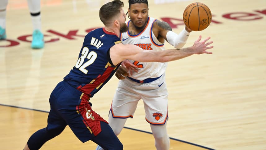 Miles McBride passing during a Knicks playoff game