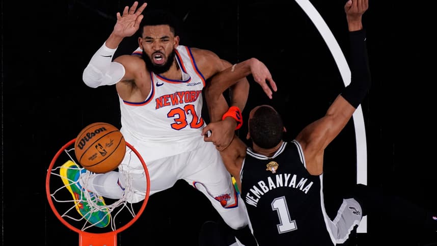 Karl-Anthony Towns shoots over Victor Wembanyama during Knicks-Spurs Game 1