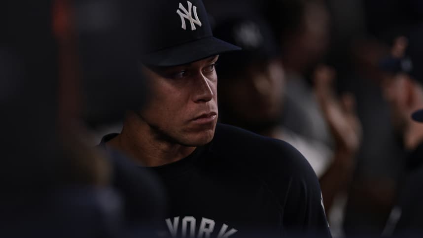Aaron Judge watches from the Yankees dugout while injured