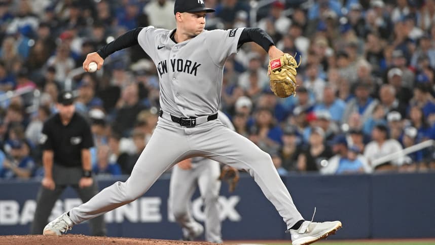 Will Warren pitching for the Yankees during a game