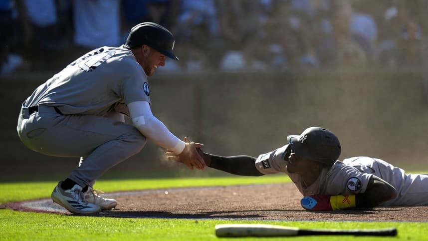 Max Schuemann celebrating a Yankees run with Jazz Chisholm Jr.