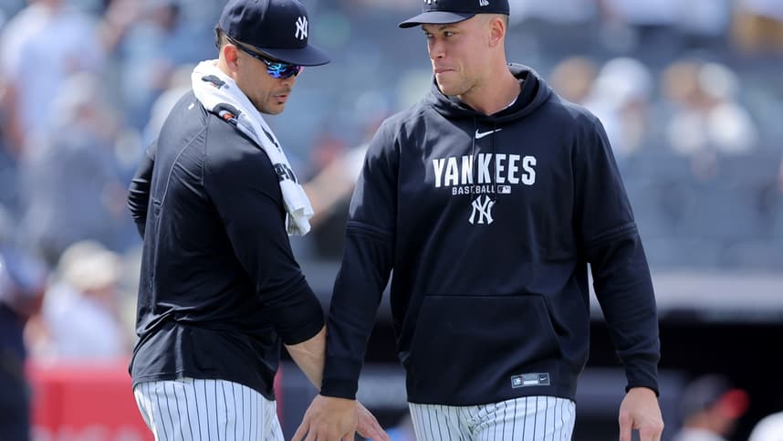 Giancarlo Stanton and Aaron Judge celebrate after a Yankees win