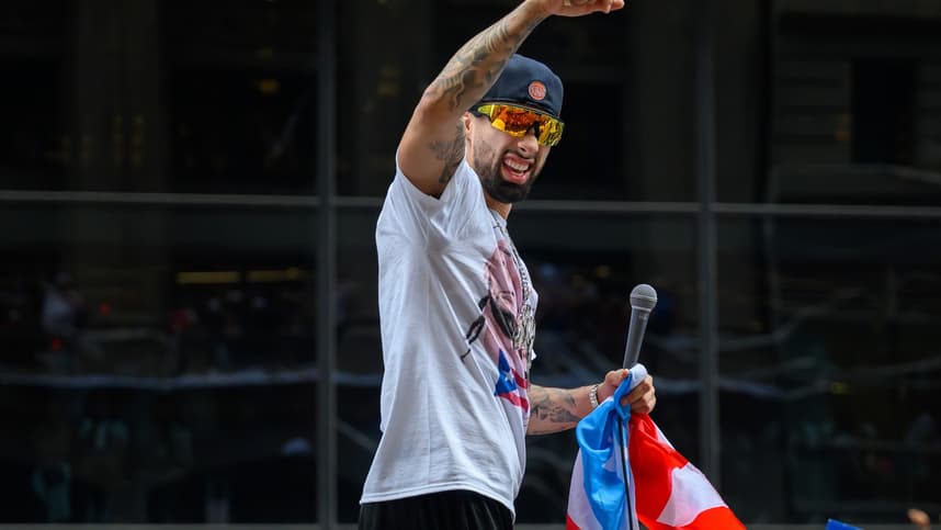 Jose Alvarado pumps his fist during the Knicks championship parade
