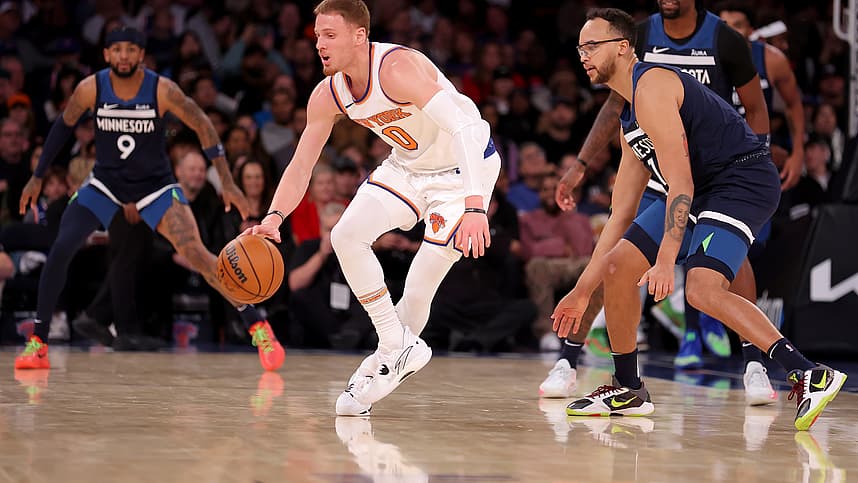 New York Knicks guard Donte DiVincenzo (0) controls the ball against Minnesota Timberwolves forward Kyle Anderson (1) during the second quarter at Madison Square Garden
