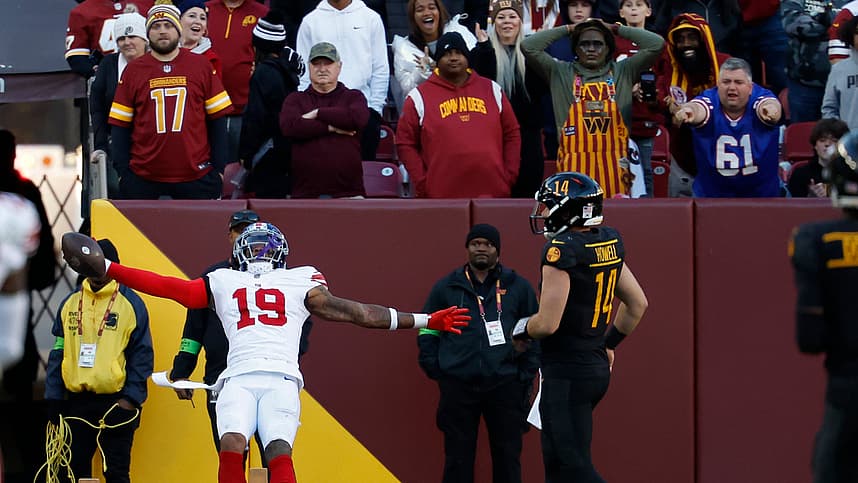 New York Giants safety Isaiah Simmons (19) celebrates while scoring a touchdown on an interception of Washington Commanders quarterback Sam Howell (14) in the final minute during the fourth quarter at FedExField.