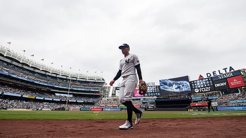 Anthony Volpe walking near the dugout before a Yankees game
