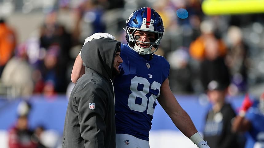 Cam Skattebo stands on the field before a Giants game