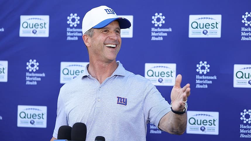 John Harbaugh speaks to reporters during Giants offseason work