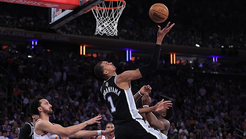 Pacome Dadiet defending during a Knicks game