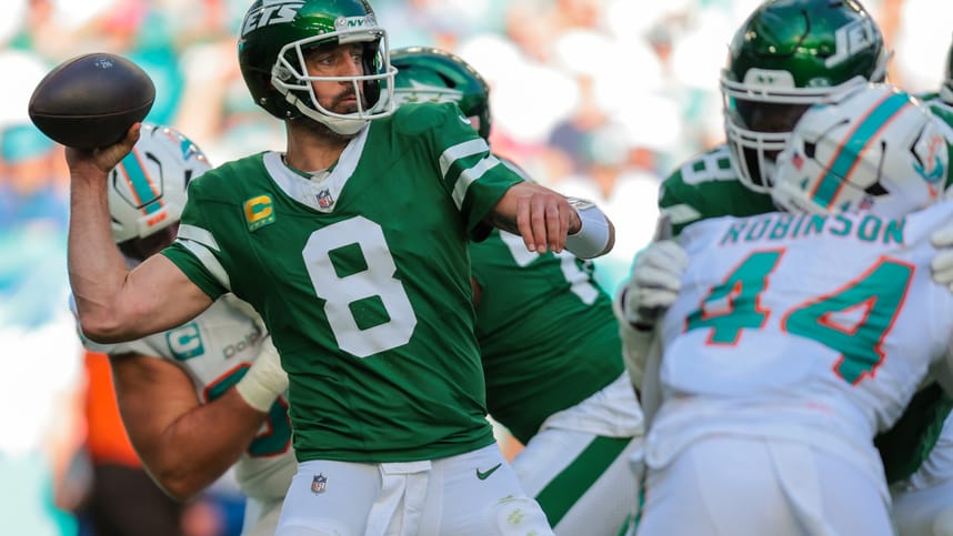 Dec 8, 2024; Miami Gardens, Florida, USA; New York Jets quarterback Aaron Rodgers (8) throws the football against the Miami Dolphins during the second quarter at Hard Rock Stadium. Mandatory Credit: Sam Navarro-Imagn Images