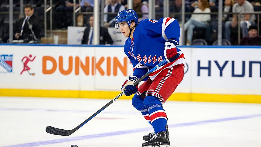 New York Rangers defenseman Braden Schneider (4) plays the puck against the San Jose Sharks during the second period at Madison Square Garden.