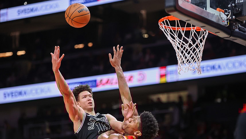 San Antonio Spurs forward Isaiah Roby (18, New York Knicks) shoots over Atlanta Hawks forward De'Andre Hunter (12) in the second quarter at State Farm Arena