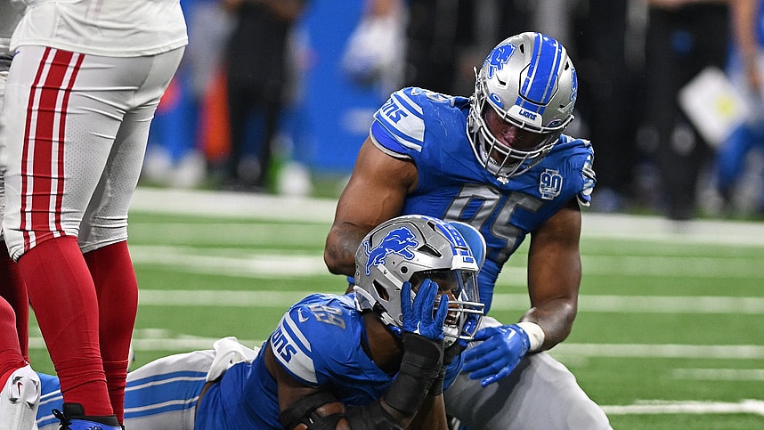 Detroit Lions linebacker Julian Okwara (99) celebrates with linebacker Romeo Okwara (95) after sacking New York Giants quarterback Tommy DeVito (5) (not pictured) in the fourth quarter at Ford Field