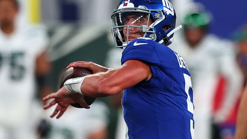 New York Giants quarterback Tommy DeVito (5) throws a pass against the New York Jets during the first half at MetLife Stadium